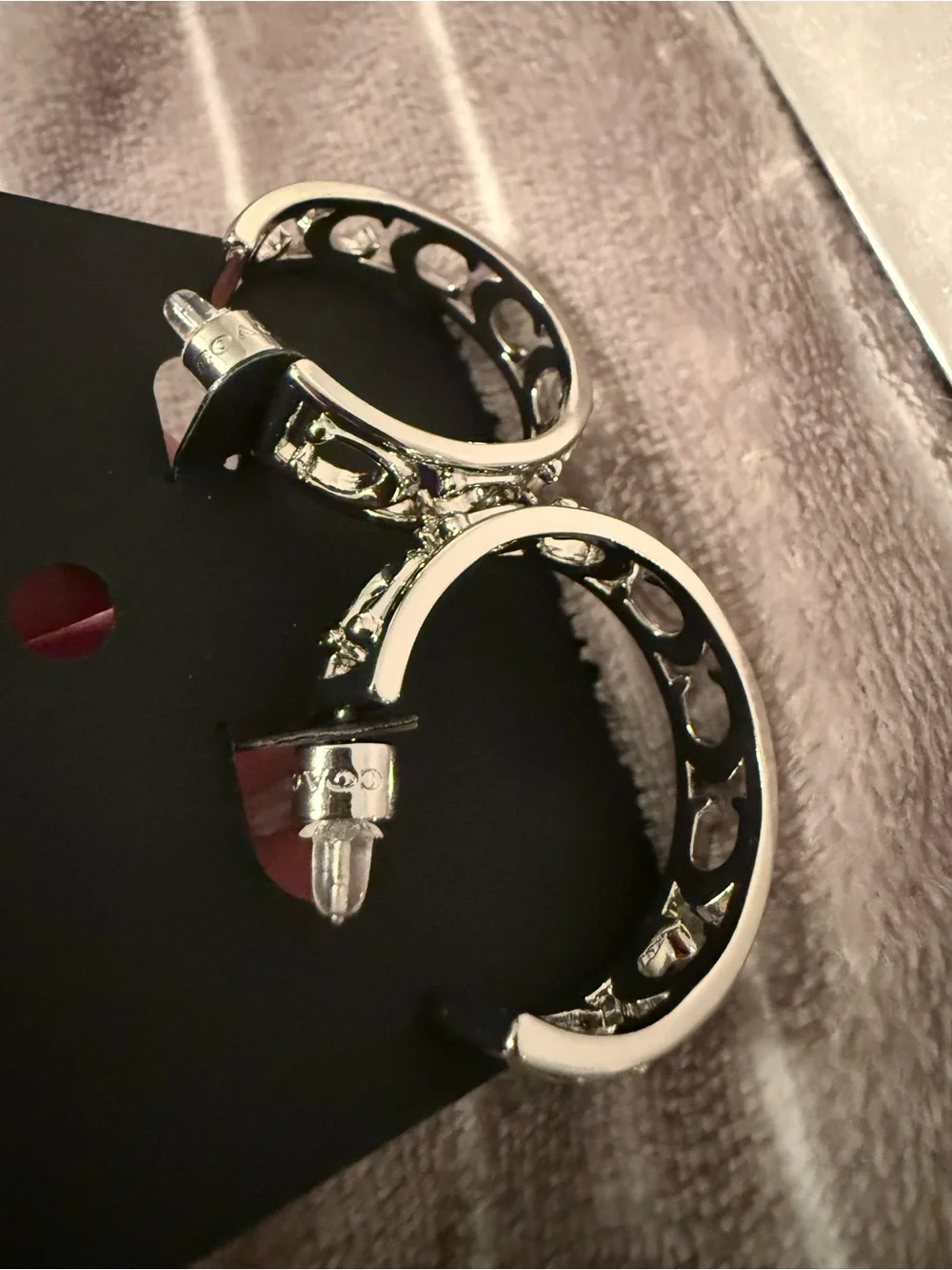 Coach Silver-Tone Decorative Hoop Earrings - Picture 3 of 3